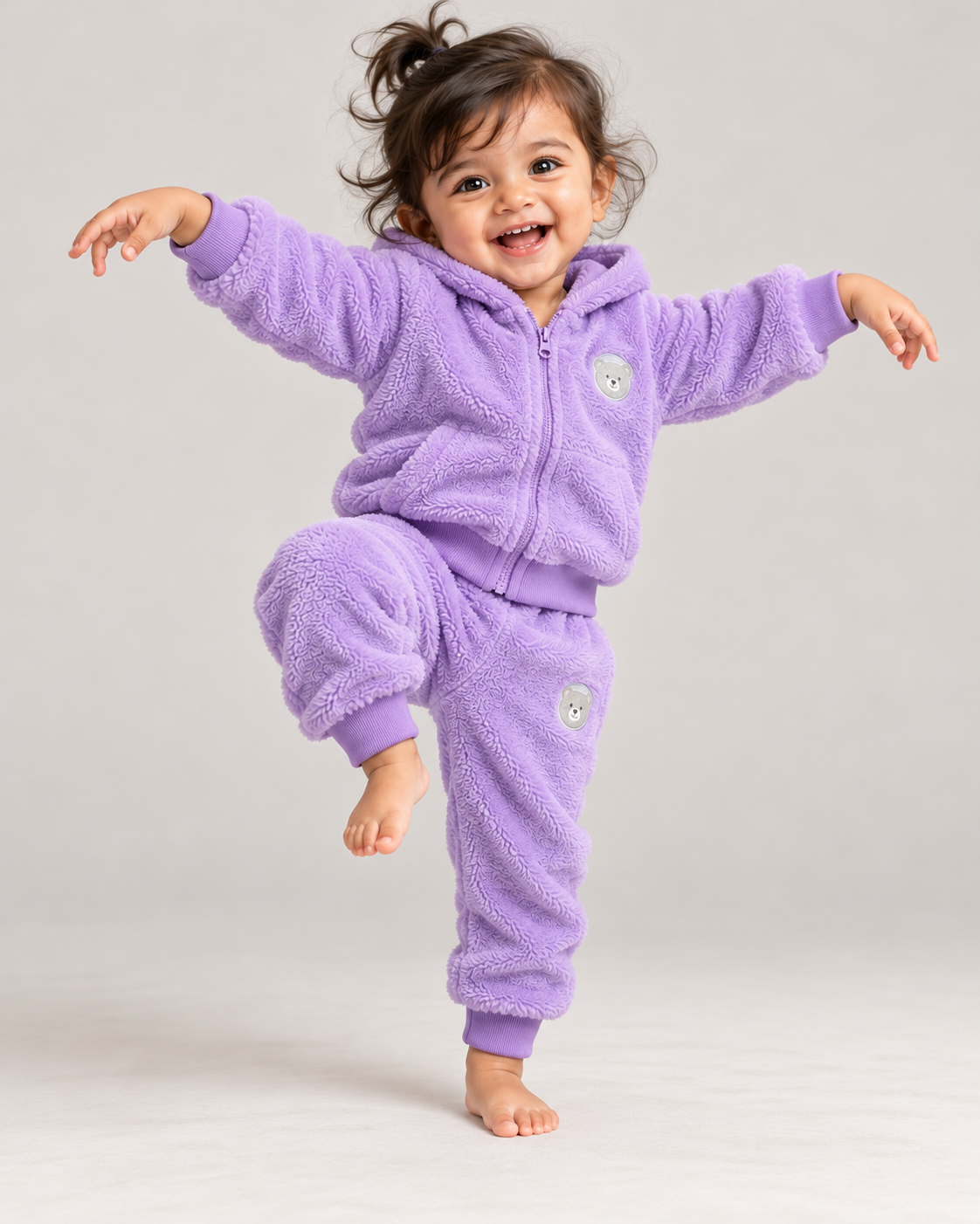 Toddler in a crane-kick pose wearing the Lavender set (illustrative image)